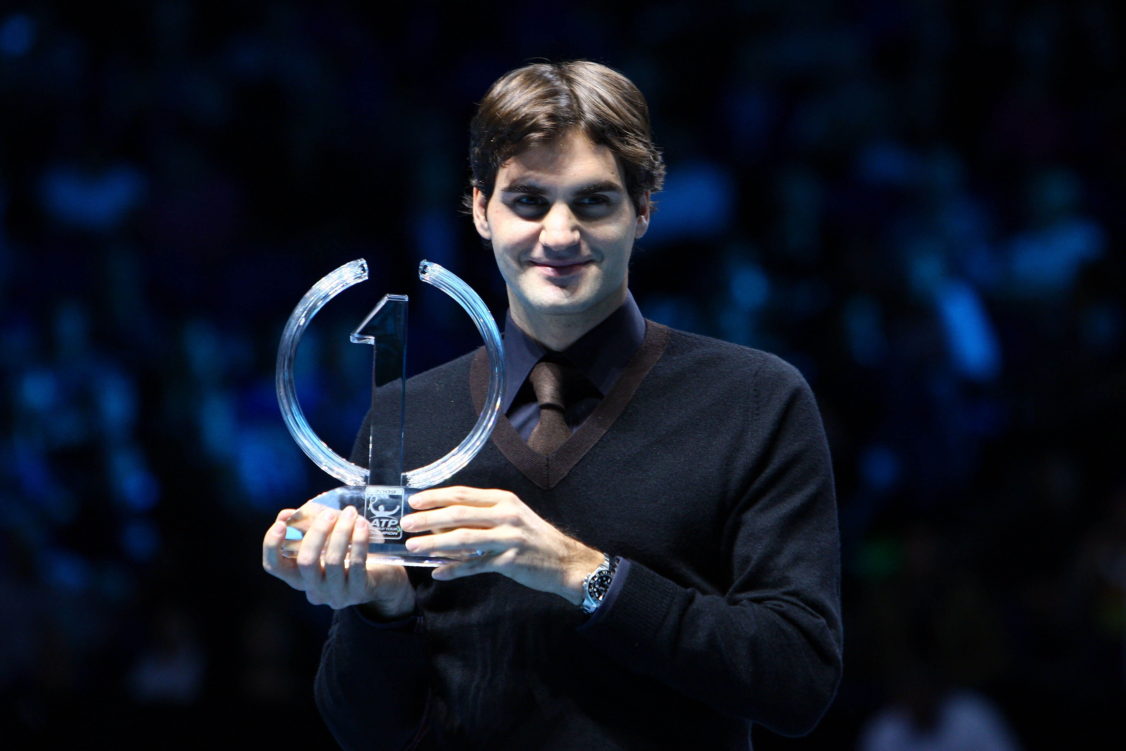 LONDON, ENGLAND - NOVEMBER 25: Roger Federer of Switzerland poses with the ATP World Tour Champion Trophy during the Barclays ATP World Tour Finals at the O2 Arena on November 25, 2009 in London, England. Federer was crowned ATP World Tour Champion for the fifth time, after becoming just the second player in the history of the ATP Rankings to regain the year-end No. 1 ranking. Federer clinched the 2009 ATP World Tour Champion title by beating Andy Murray at the Barclays ATP World Tour Finals on November 24. (Photo by Julian Finney/Getty Images)